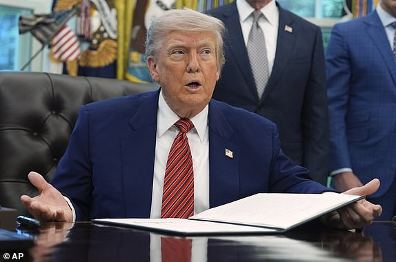 President Donald Trump speaks as signs an executive order regarding nuclear energy in the Oval Office of the White House, Friday, May 23, 2025, in Washington. (AP Photo/Evan Vucci)