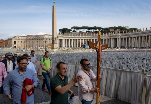 A group carries a cross as part of the Jubilee...