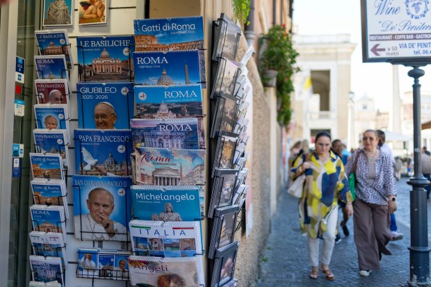 Souvenir shops sell more items depicting Pope Francis and Pope...