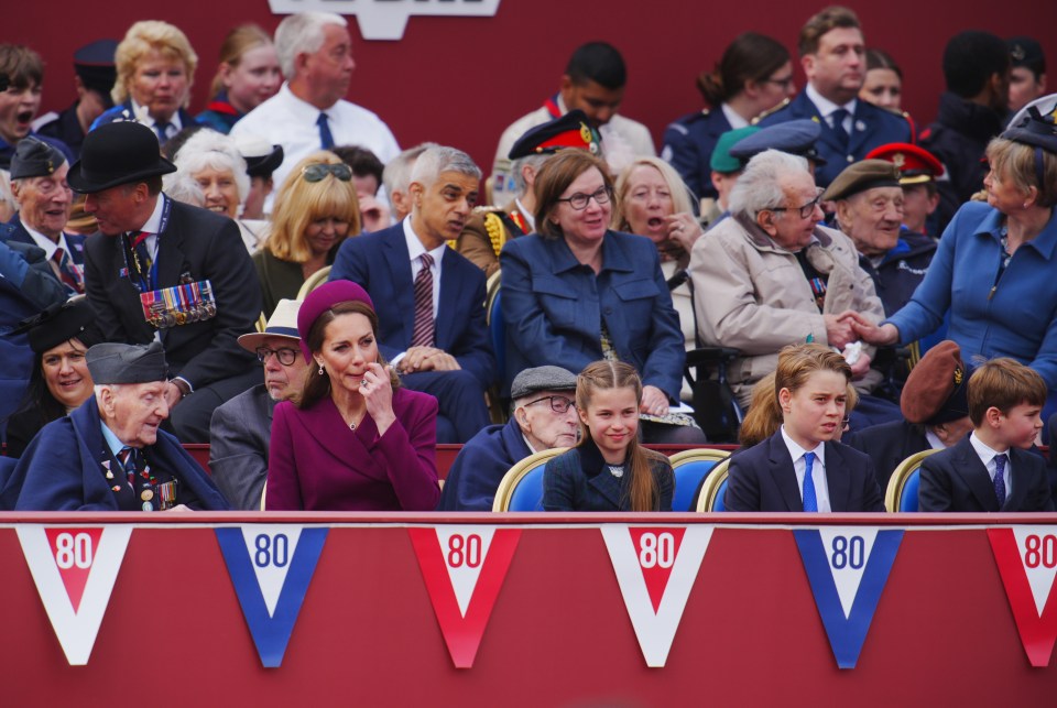 The Princess of Wales and family watching a VE Day military procession at Buckingham Palace.