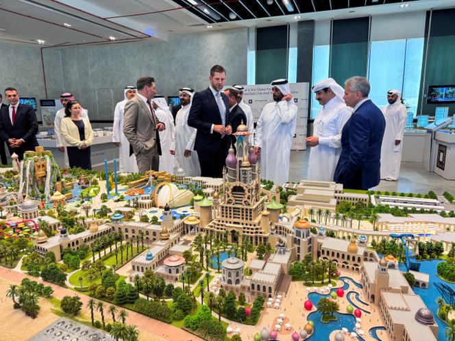 Eric Trump, executive vice president of the Trump Organization, stands beside the model of the Trump International Golf Club & Trump Villas project with Abdullah Al Attiya, Qatar's Minister of Municipality and president of Qatari Diar, in Doha, on April 30, 2025.