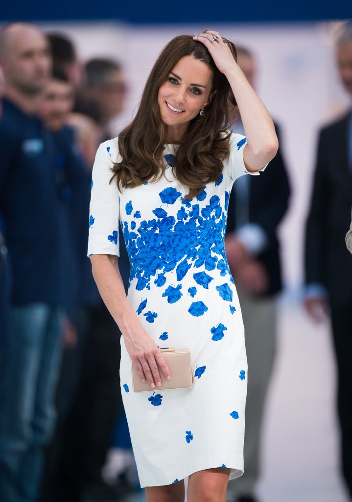 Kate Middleton wearing a white and blue dress at the Hayward Tyler Luton on August 24, 2016 in Luton, England. 