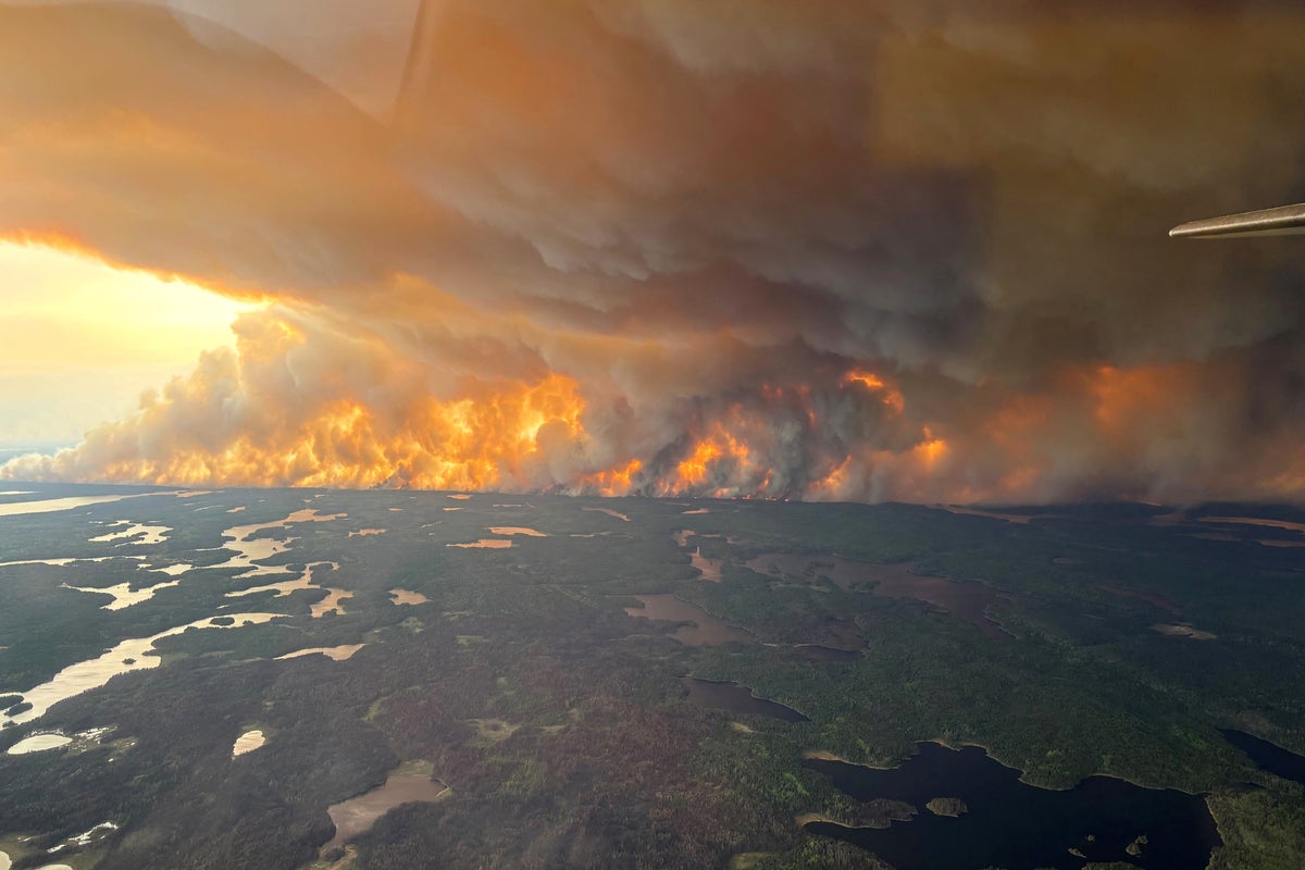 17,000 forced to evacuate as forest fires rage across Manitoba