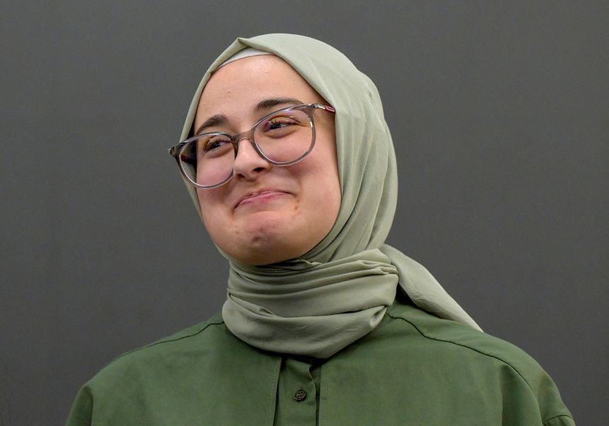 Tufts University student Rumeysa Ozturk, of Turkey, arrives at a news conference at Boston Logan International Airport after she was released on a judge's order.