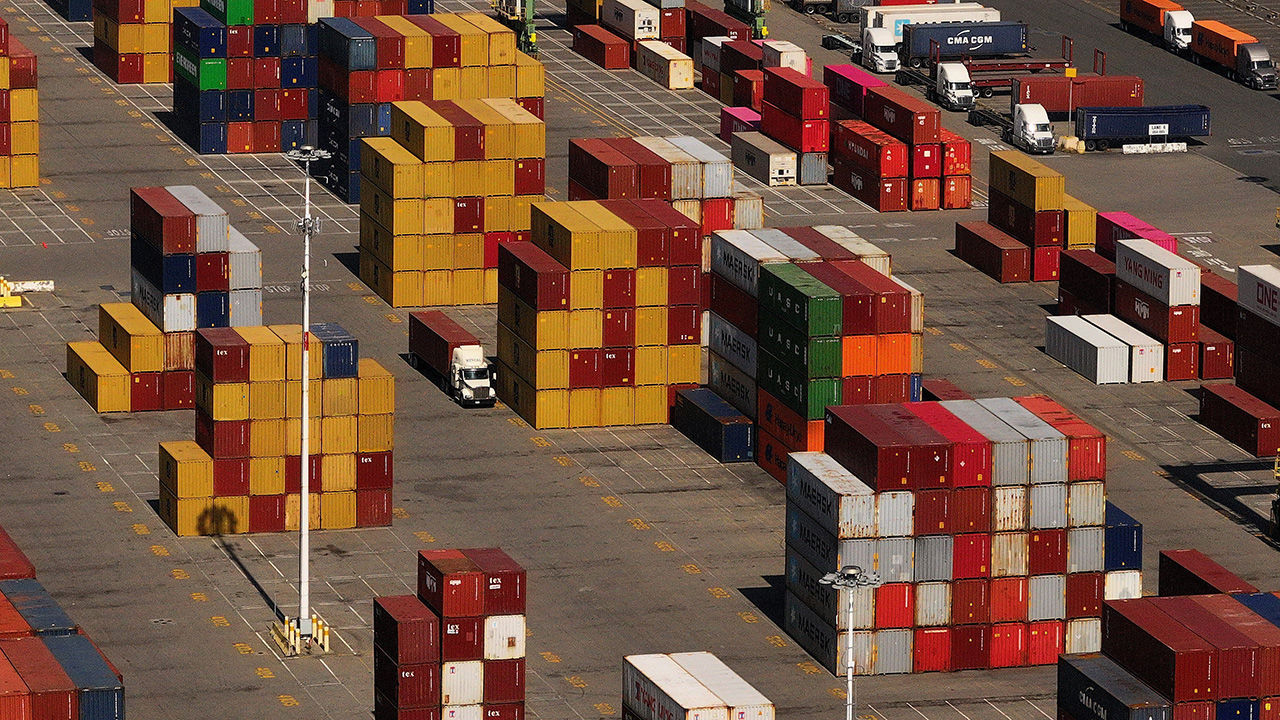 Shipping containers are stacked at the Port of Oakland in Oakland, California