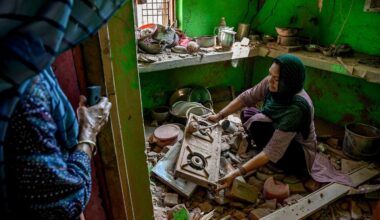 Nishu Devi searches for salvageable items in the wreckage of her home following overnight Pakistani artillery shelling in the village of Pahari Wala, in the Jammu district of the part of Kashmir controlled by India, on May 13, 2025.