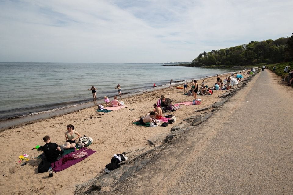 People enjoying the sunny weather at Helens Bay Beach on the 30th April 2025 (Luke Jervis/Belfast Telegraph)