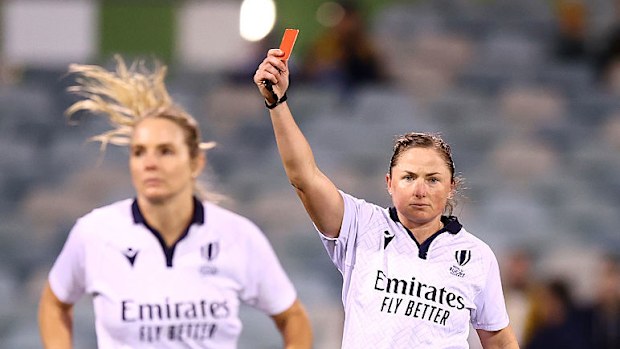 Referee Aimee Barrett-Theron gives Alev Kelter of the USA a red card.