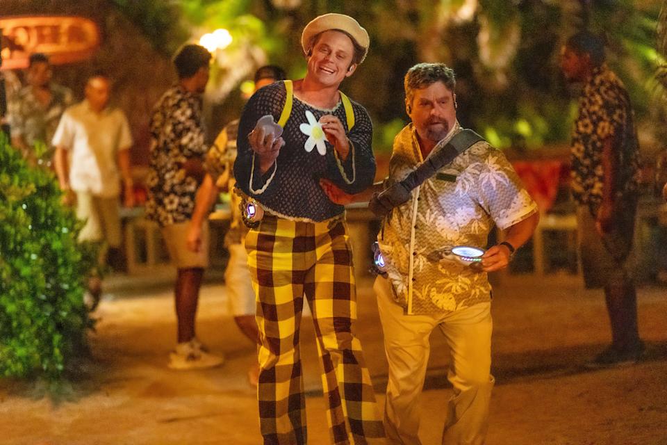 Pleakley (Billy Magnussen, left) and Jumba (Zach Galifianakis) camouflage themselves as humans as they search for Stitch.