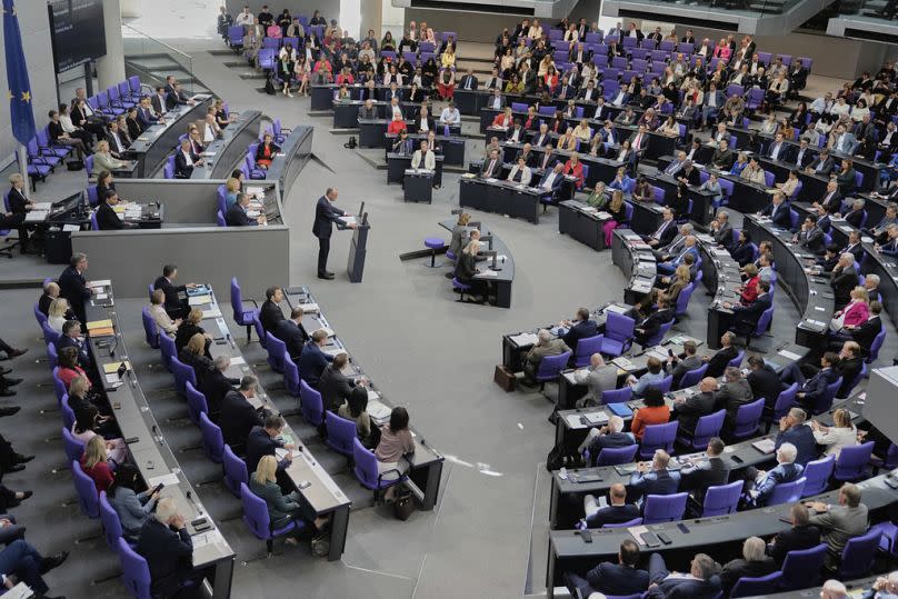 Friedrich Merz delivers his first speech as German Chancellor in the parliament in Berlin, Germany, Wednesday, May 14, 2025