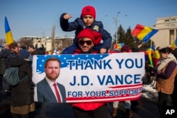 Supporters of Calin Georgescu at a rally in February 2025
