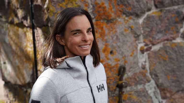 A young woman in a sports jacket.