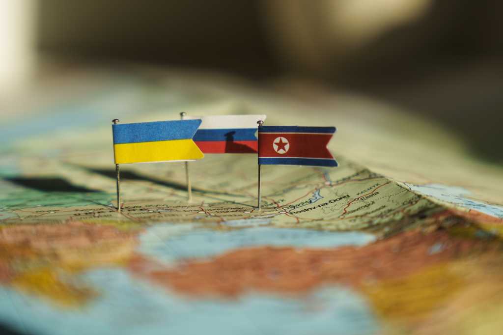 Ukraine, Kyiv - 2024 October 19: Ukraine, North Korea and Russia flags on Ukraine geopolitical map. North Korea fights on Ukraine lands
