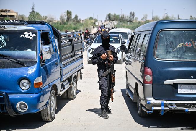 A general security agent mans a checkpoint near the only crossing of the Euphrates connecting the East and West of Deir Ezzor, Syria, April 28, 2025.