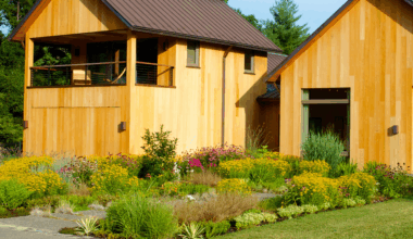 beautiful wildflower lawn in front of a modern wooden cabin house