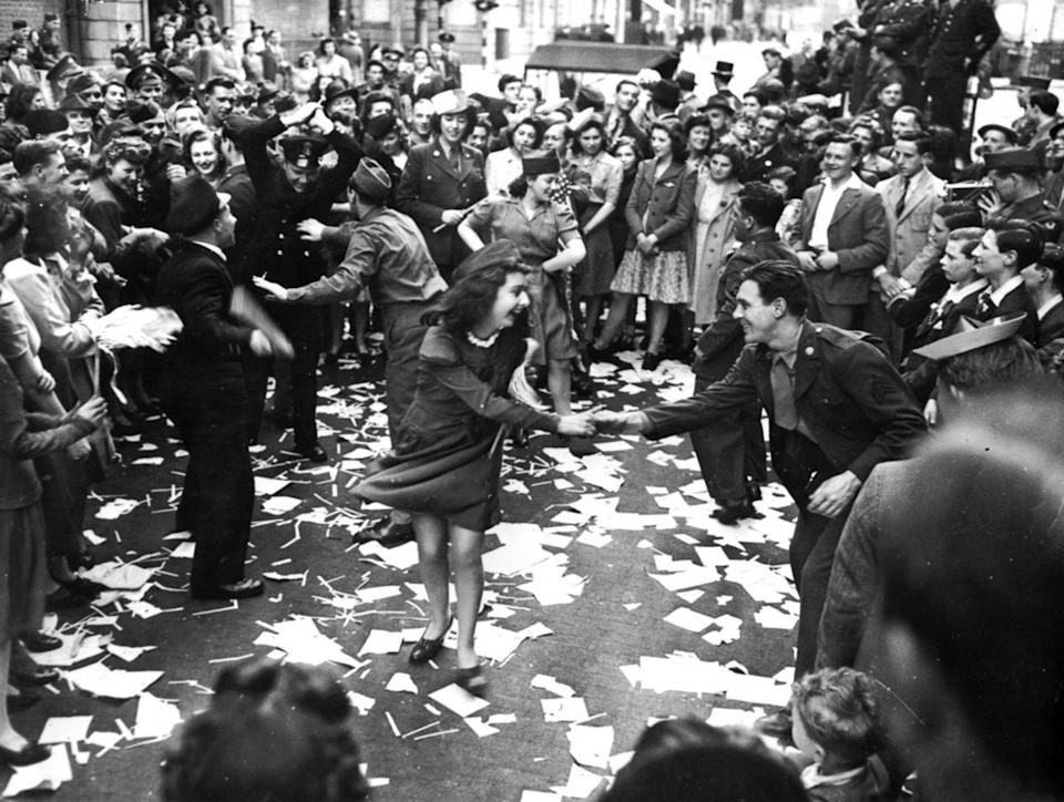 People dancing in the streets on VE Day (Victory in Europe Day), the 8th May 1945