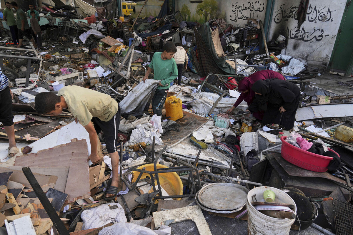 Palestinians examining the damage at a school hit by Israeli military strike which killed at least 36 people in Gaza City on Monday, May 26, 2025. Picture: Jehad Alshrafi/AP