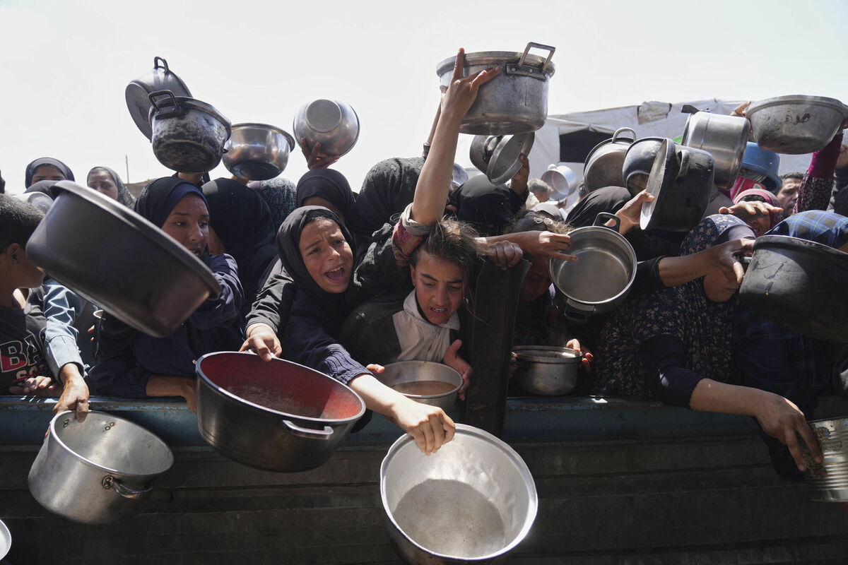 Palestinians struggle to get donated food at a community kitchen in Khan Younis, Gaza, on Monday, May 5, 2025. Picture: Abdel Kareem Hana/AP