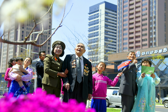 North Koreans are seen at a newly built apartment complex in Pyongyang in this file photo, released by the Korean Central News Agency on April 27, 2025. [NEWS1] 