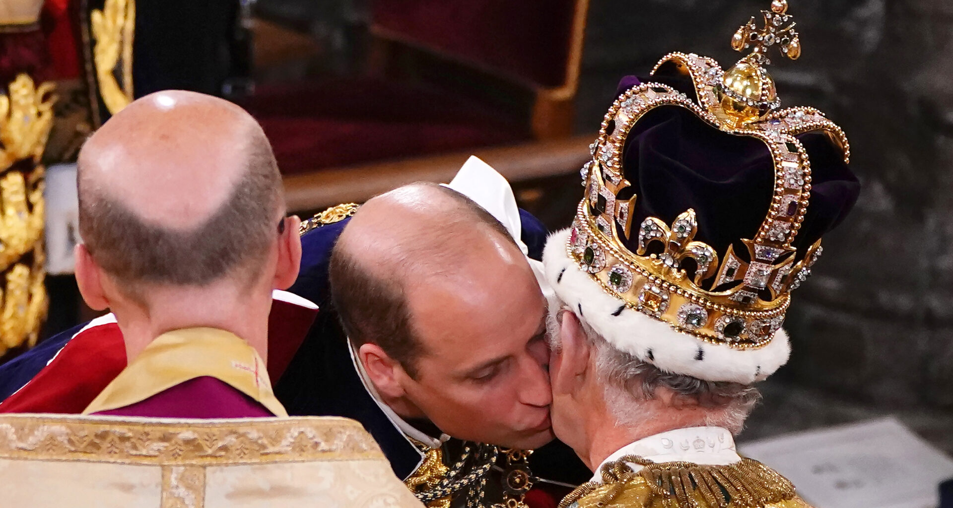 Prince William kissing King Charles at his coronation