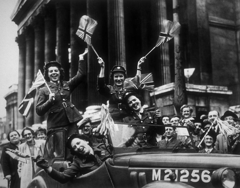 Members of the Auxiliary Territorial Service (ATS) , driving through Trafalgar Square in a service vehicle during the VE Day celebrations in London, 8th May 1945. (Photo by R J Salmon/Fox Photos/Hulton Archive/Getty Images)