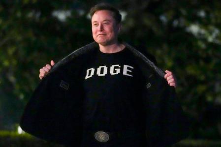 Elon Musk shows off a shirt that says 