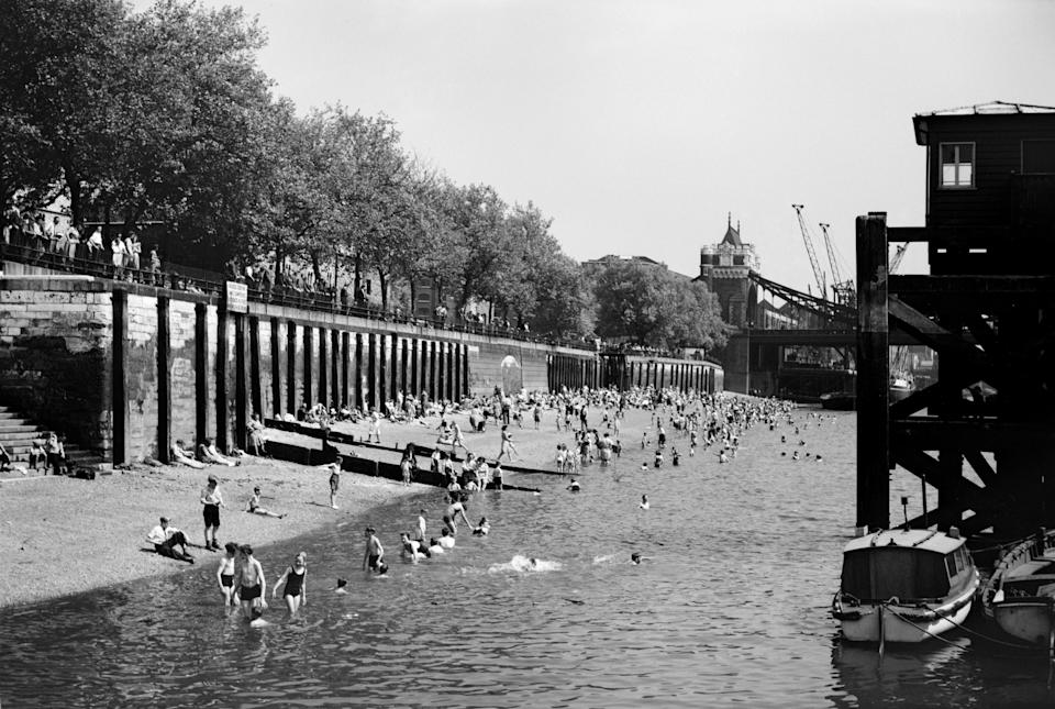 Bathers at Tower Beach, London, c1945-c1965. With people swimming in the river and sunbathing on the riverbank. Looking east towards Tower Bridge from Tower Pier. (Photo by English Heritage/Heritage Images/Getty Images)