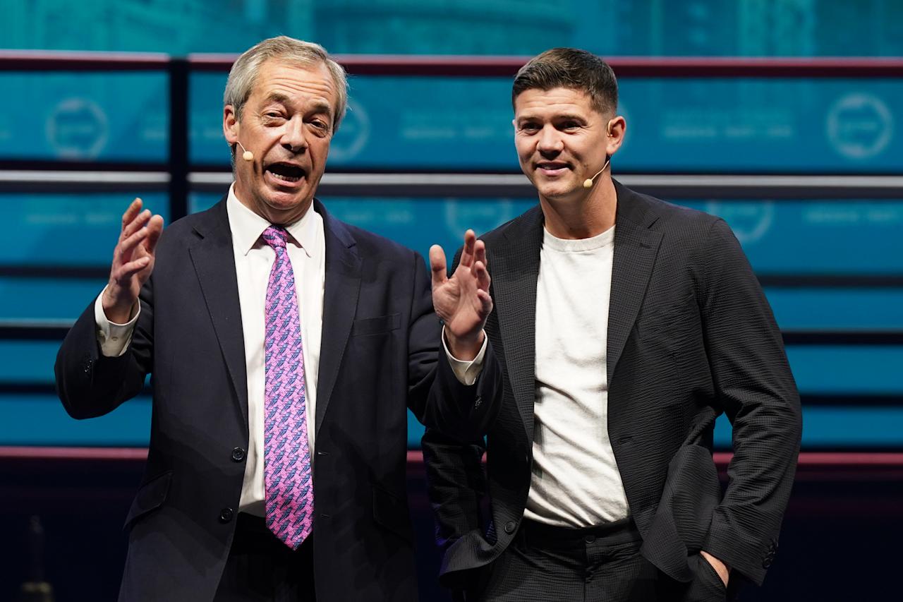 HULL, ENGLAND - FEBRUARY 27: Olympic boxer Luke Campbell, (R) who is Reform’s mayoral candidate for Hull stands with Reform UK leader Nigel Farage as he speak to the audience on February 27, 2025 in Hull, England. The Reform Party candidate joins Rowan Halstead (Yorkshire Party), Anne Handley (Conservatives), Kerry Harrison (Green), Margaret Pinder (Labour), and Mike Ross (Liberal Democrats) in their bid to be the first elected mayor of the Hull and East Yorkshire Combined Authority. The vote will take place on Thursday, May 1. (Photo by Ian Forsyth/Getty Images)
