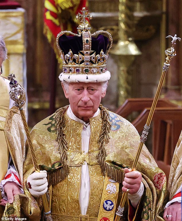 King Charles III stands solemnly after being crowned at Westminster Abbey