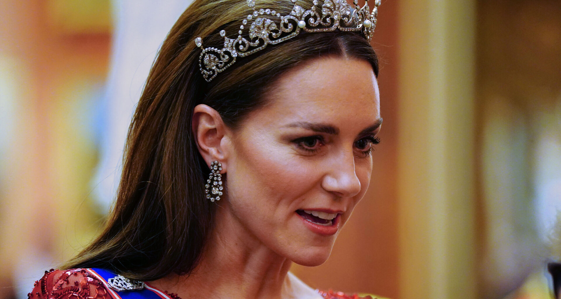 Kate Middleton wearing a tiara and a red gown