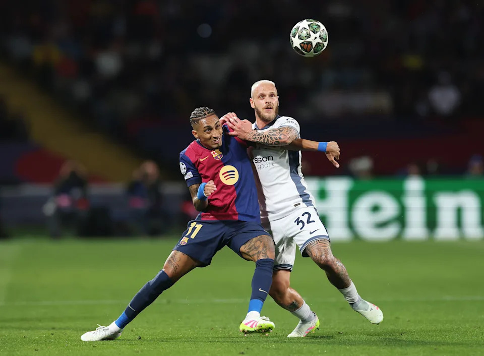 BARCELONA, SPAIN – APRIL 30: Raphinha of FC Barcelona battles for possession with Federico Dimarco of FC Internazionale during the UEFA Champions League 2024/25 Semi Final First Leg match between FC Barcelona and FC Internazionale Milano at Estadi Olimpic Lluis Companys on April 30, 2025 in Barcelona, Spain. (Photo by Carl Recine/Getty Images)