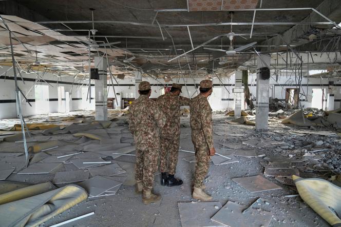 Pakistani soldiers inspect the inside of a mosque destroyed by Indian missiles, in Muridke, in the Punjab province on May 7, 2025.