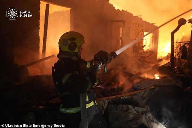 'We have enough strength and means to bring what was started in 2022 to a logical conclusion with the outcome Russia requires,' he added. Pictured: Rescuers extinguishing a fire after drone attack in Kyiv on May 4