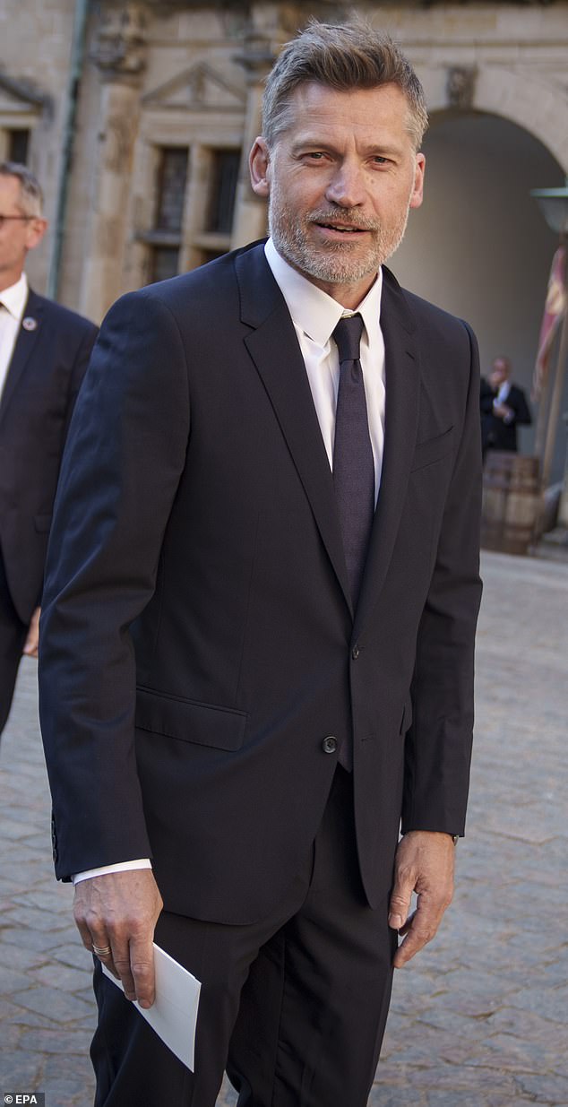 The 54-year-old looked smart in a sharp navy suit and tie as he arrived at the star-studded event
