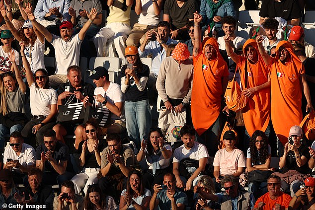 Spectators dressed up as carrots and sported orange clothing to show support for Sinner
