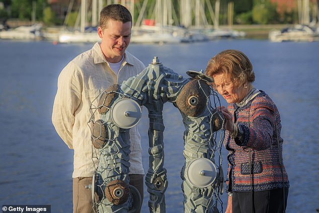 The Queen was also spotted mingling with various graduates and guests at the academy, as the group made their way around the various sculptures