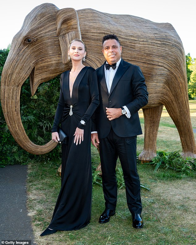 Brazilian footballer Ronaldo Nazario (pictured, right) posed for snaps with his wife, model Celina Locks (pictured, left)