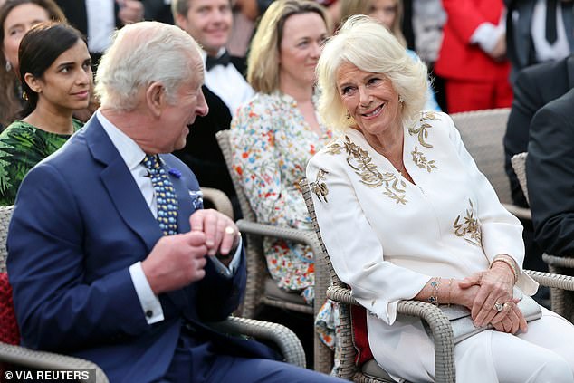 Charles (pictured, left) and Camilla (pictured, right) were snapped chatting to each other during the event