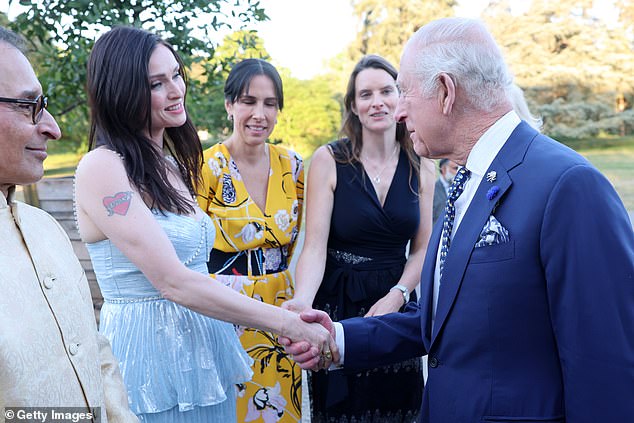 King Charles (pictured, right) meets singer Sophie Ellis-Bextor (pictured, second from left) during The Elephant Family Evening of Art and Conservation