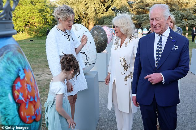 Artist and influencer Sophie Tea (pictured, second from left) meets Queen Camilla and King Charles