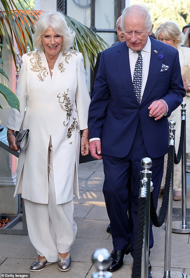 While it was an emotional evening at times for the Queen (pictured) she appeared to be enjoying the charity event (seen with King Charles)