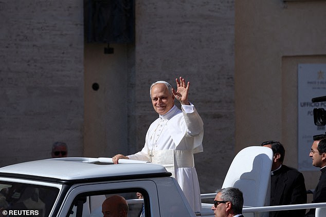Pope Leo XIV arrives on the popemobile for his inaugural Mass at the Vatican