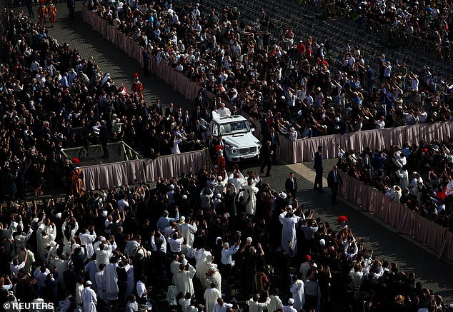 Pope Leo XIV arrives on the popemobile for his inaugural Mass at the Vatican