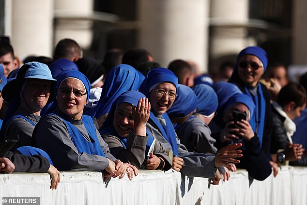 Nuns react on the day Pope Leo XIV holds his inaugural Mass in Saint Peter's Square