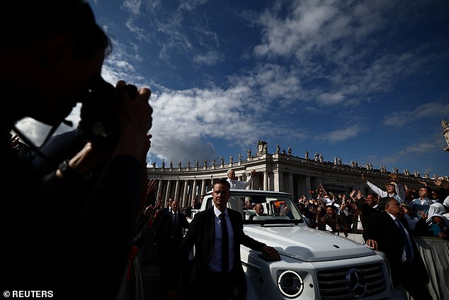 Pope Leo XIV arrives on the popemobile for his inaugural Mass at the Vatican