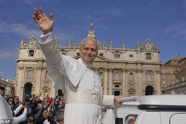 Pope Leo XIV waves to the crows as he tours St Peter's on the popemobile -- May 18, 2025