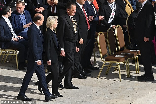 European Commission President Ursula Von der Leyen (centre) arrives to attend a Holy Mass