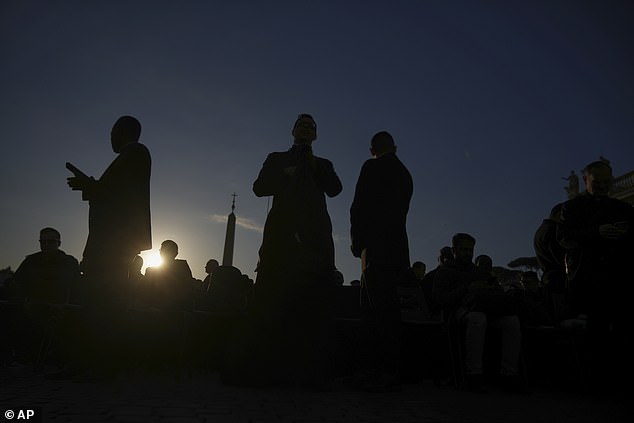 People gather to attend Pope Leo XIV's formal inauguration of his pontificate with a mass in St. Peter's Square