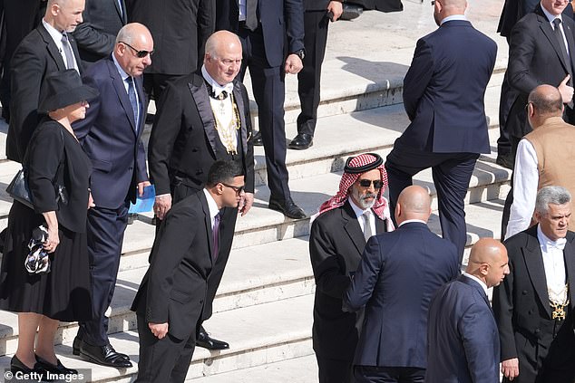 Jordanian Prince Ghazi bin Mohammad (centre) is greeted as he arrives for Pope Leo XIV's Inauguration mass