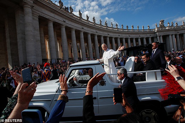 Pope Leo XIV waves to the faithful from the popemobile -- May 18, 2025